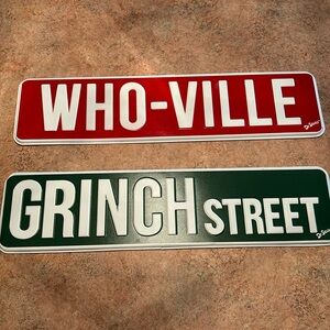 Dr Seuss Who-Ville and Grinch Street tin decorative signs.